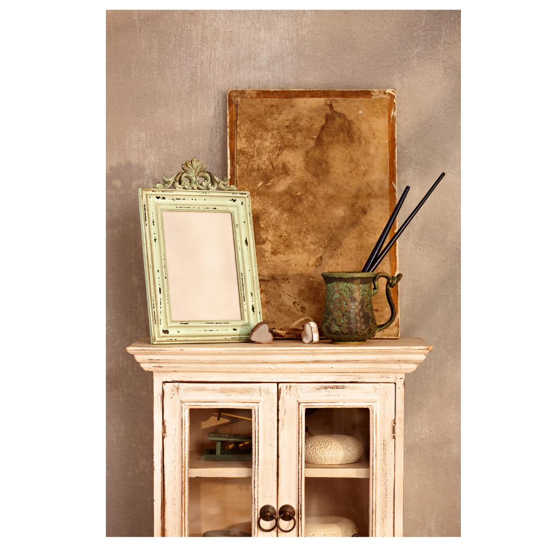 Vintage painted cupboard with frames and pictures